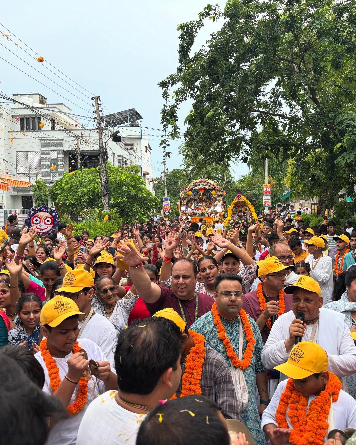Devotees pulling the Ratha Yatra chariot through the streets of Rewari