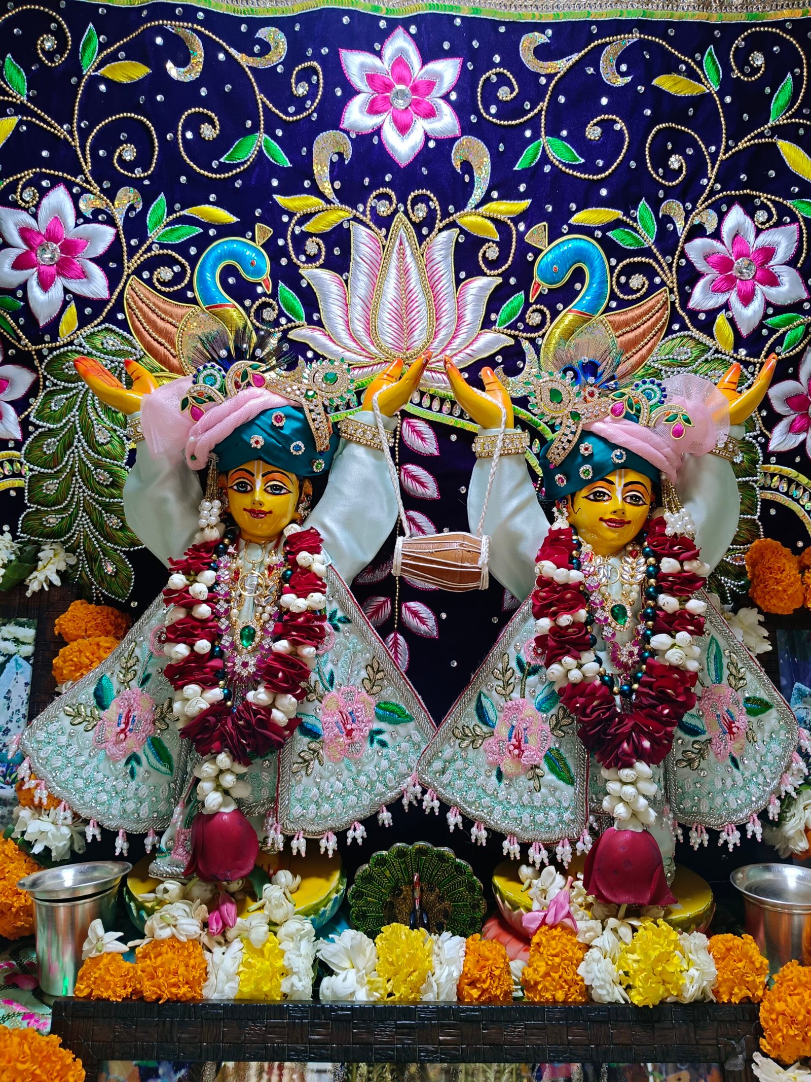 Deities worshipped at ISKCON Rewari, decorated with garlands and ornate garments