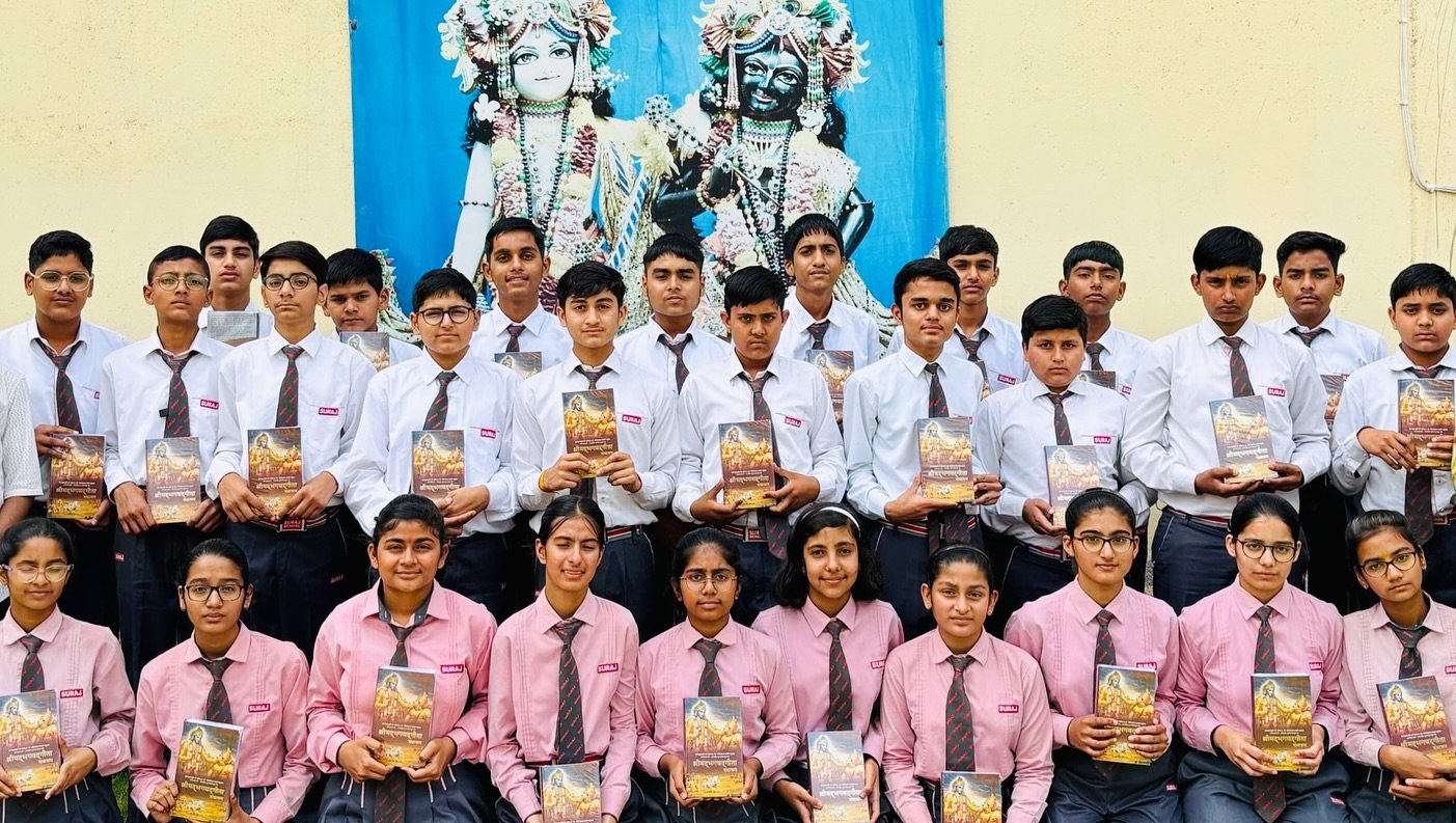 Students holding Bhagavad Gita books at Value Education Program by ISKCON Centre Rewari